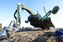 Boom supports weight of machine